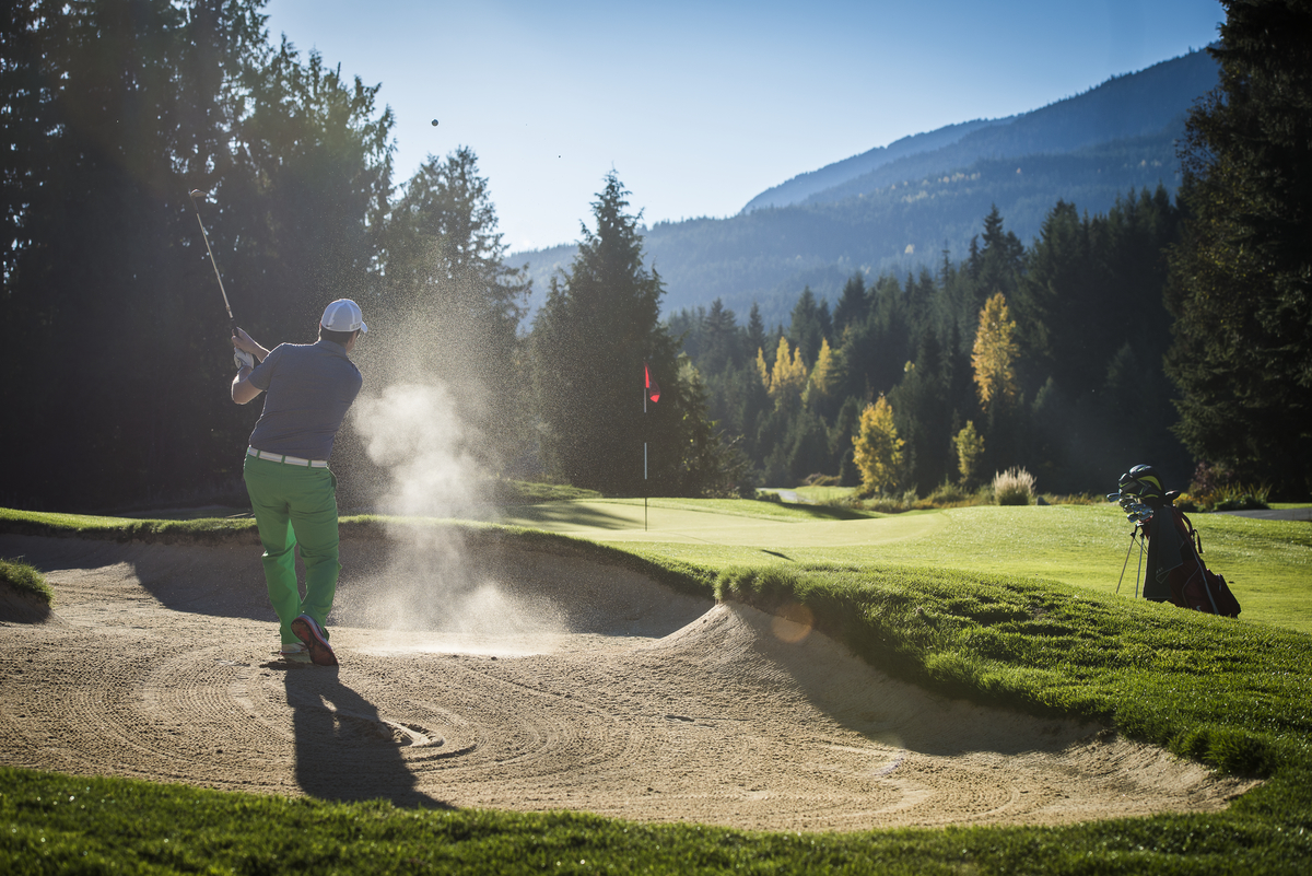 Whistler in the summer: man golfing in the sun.