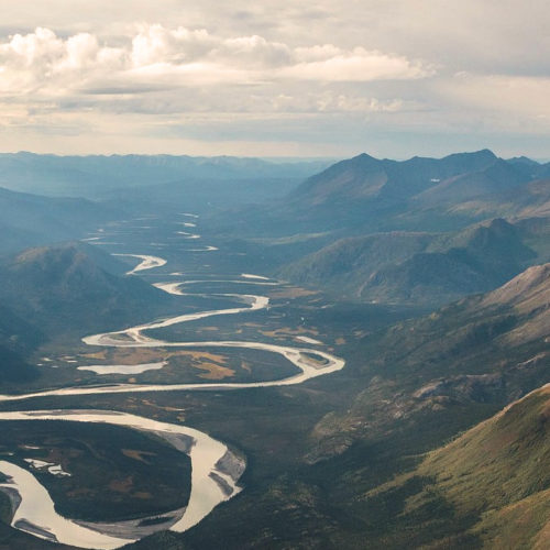 The best time to travel to Alaska: a river through the mountains.