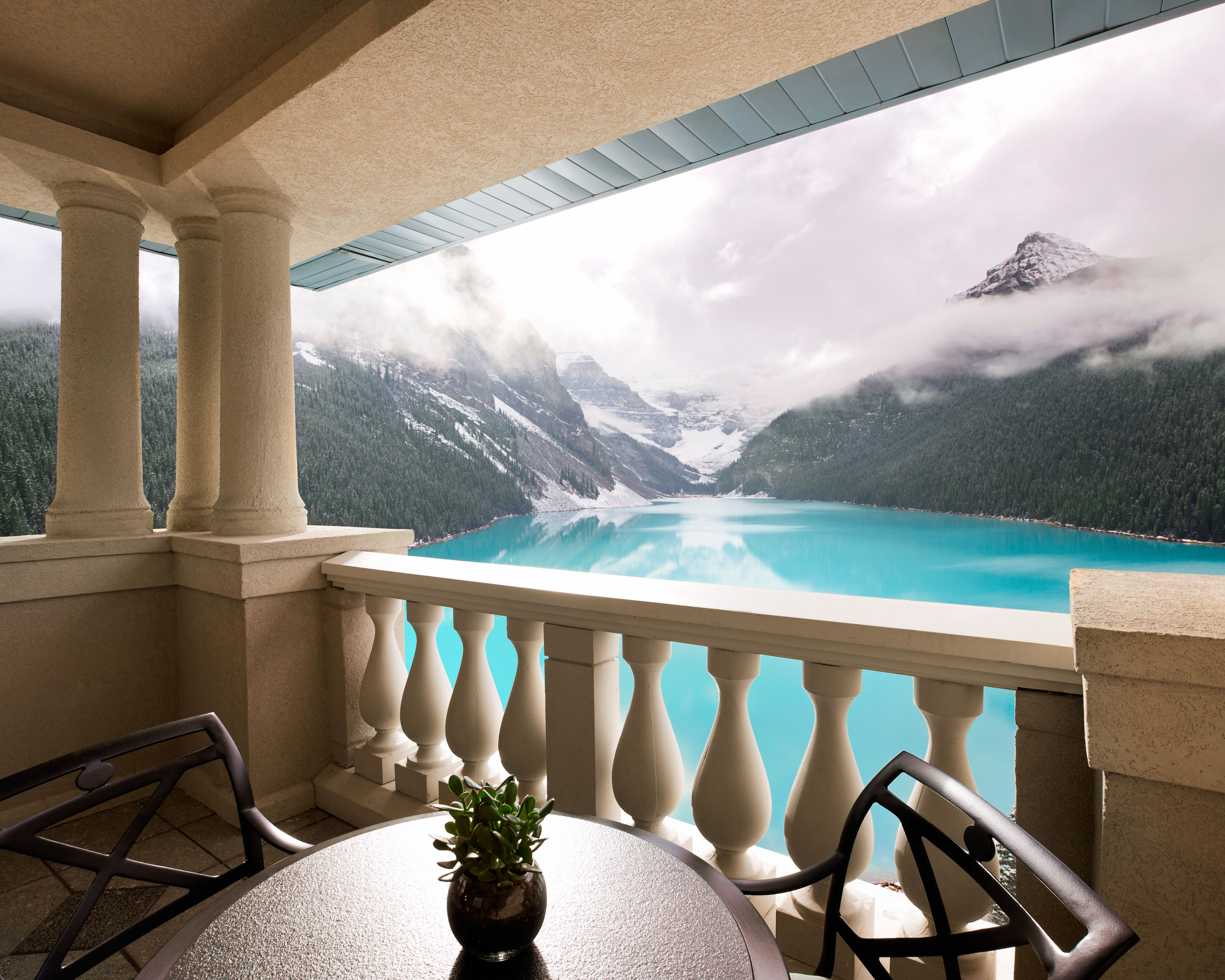 Luxury Family Vacations: a stunning hotel balcony overlooking Lake Louise. 