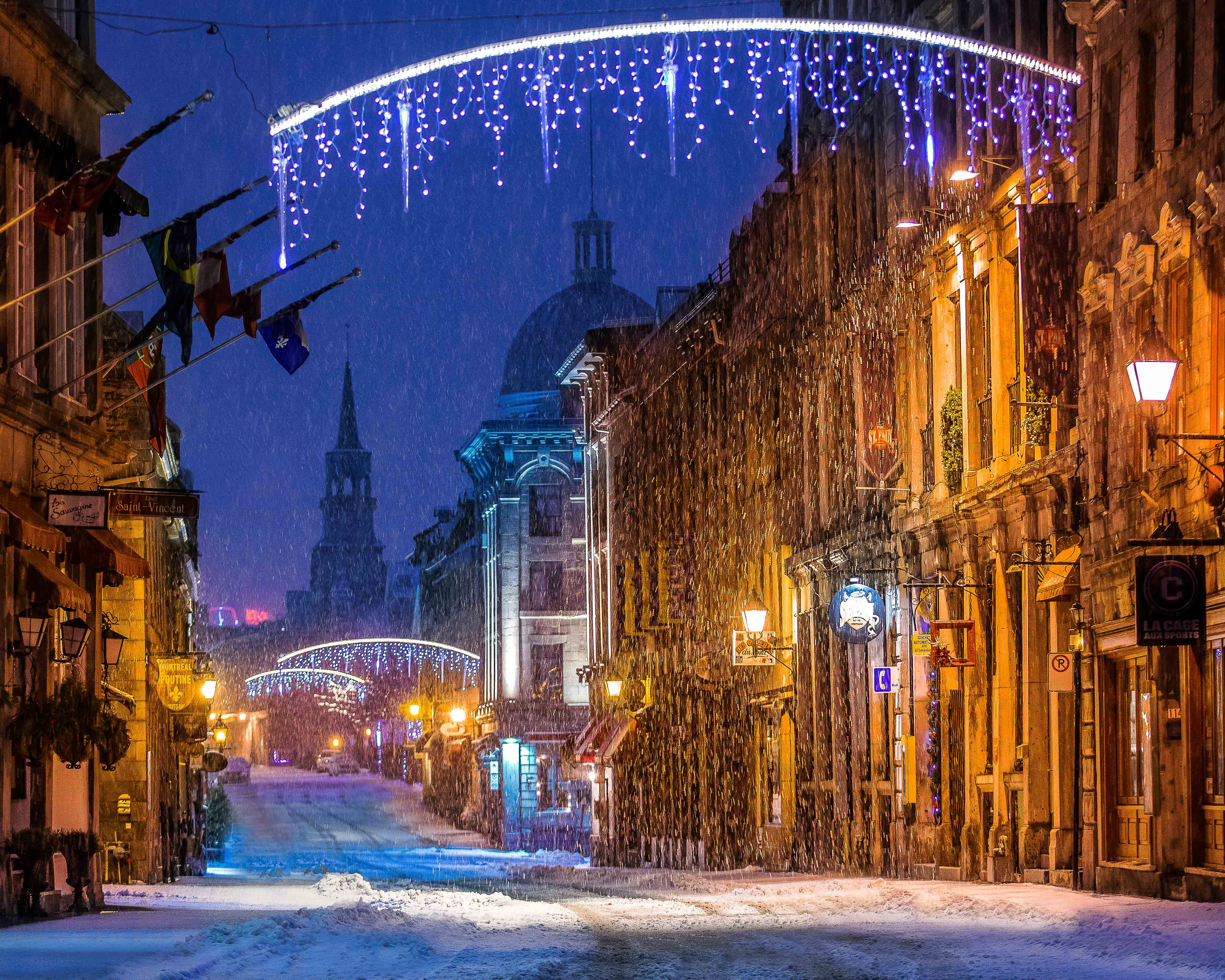 Montreal Travel Guide: snow falling in Montreal at Christmas. 